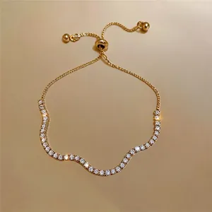 Elegante goudkleurige armband in Franse stijl met strass en verstelbare trekkoordsluiting