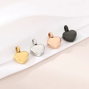 Detailed view of heart-shaped pendants in gold, silver, rose gold and black colors