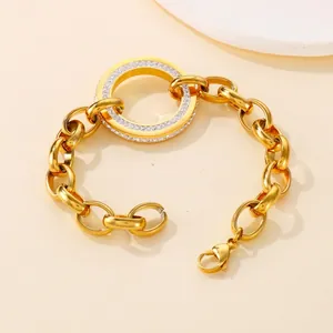 Stainless steel chunky link gold bracelet featuring a pave crystal encrusted ring element