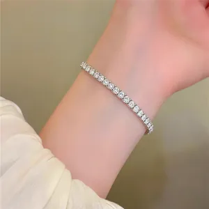 Close-up of elegant French style round set diamond elastic tennis bracelet on a wrist