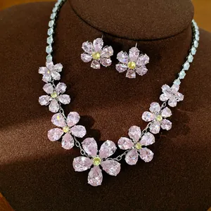 Close-up of pink and yellow zircon flower necklace set with matching stud earrings