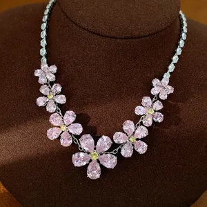 Detailed view of an elegant zircon flower necklace with pink and yellow crystal petals