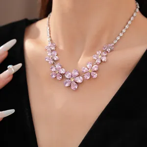 Exquisite zircon flower necklace featured on model's neck for a sweet, luxury look.