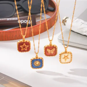 Close-up detail of colorful enamel square pendants with star, sun, butterfly and starfish motifs