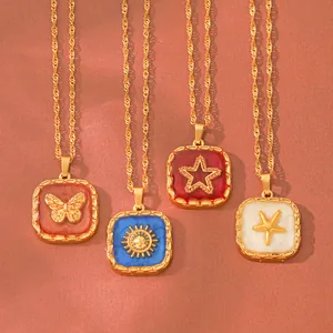 Detail of square embossed enamel necklaces with butterfly sun star and starfish charms
