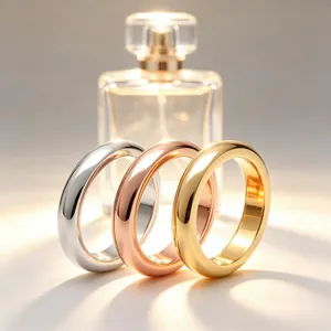 Detailed view of three polished stainless steel rings in silver, gold, and rose gold