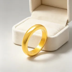 Detailed macro view of a minimalist polished gold-finish stainless steel plain band ring.