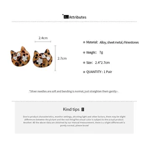 Detailed view of vintage leopard print cat earrings with rhinestones and size info.