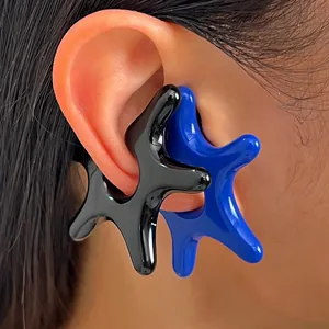 Close-up detail of irregular starfish acrylic ear cuffs in black and blue colors.