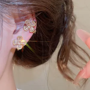 Macro view of elegant vintage sparkling zircon flower ear clips for non-pierced users