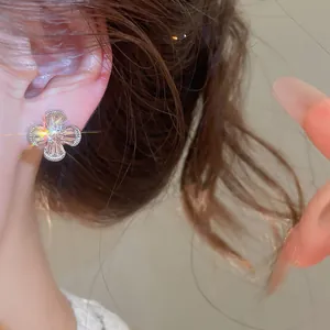 Close-up of vintage zircon flower earrings showing brilliant sparkle and detail