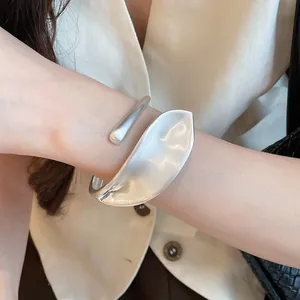 Close-up of vintage silver leaf cuff bracelet with matte and polished finish