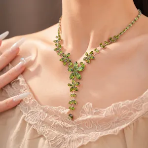 Close-up view of an elegant green zircon flower necklace on model for a vintage court style