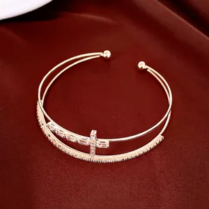 Elegant 18k gold plated double-layer open bangle with a sparkling zircon cross detail