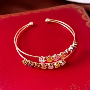 Double-layered gold bangle with colorful square zircon stones for elegant women's jewelry