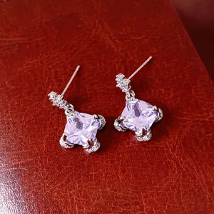 Elegant silver stud earrings featuring square lavender zircon and shimmering pavé accents