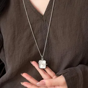 Minimalist silver polygon watch pendant necklace on a long chain