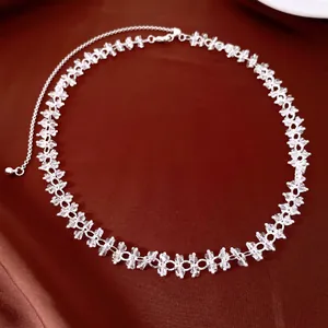 Detailed view of clear crystal beads on a delicate silver-colored choker necklace.