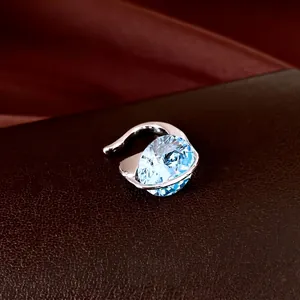 Silver oval blue zircon ear cuff with minimalist no-piercing hollow design