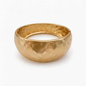 Fashionable gold-tone wrinkled resin oval bangle with unique hammered texture