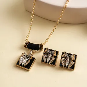 Detailed close-up view of vintage butterfly jewelry set with rhinestones and black enamel