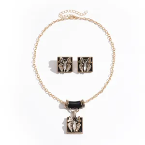 Vintage-style butterfly jewelry set including a necklace and earrings with rhinestones