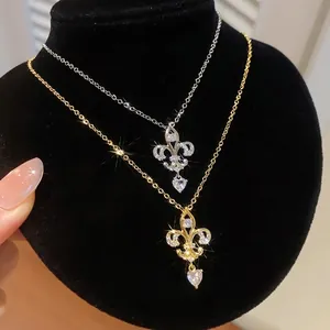 Elegant 14K gold plated zircon heart chandelier necklaces displayed on black velvet stand