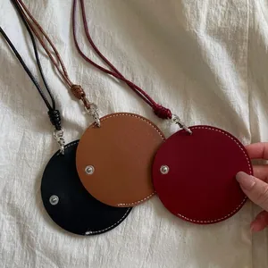 Handmade leather cord round pendant eyeglass holder necklace in black, brown and red.