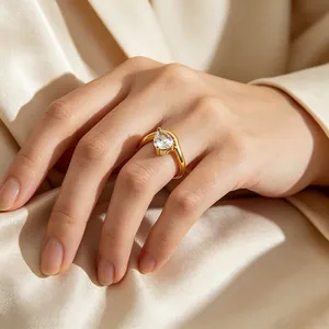 Close-up detail of a minimalist teardrop zircon ring in 14k gold plated stainless steel