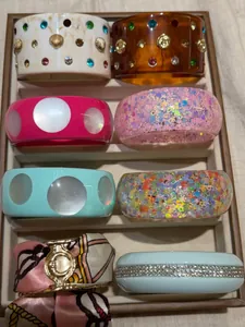 A selection of colorful acrylic and resin bangles displayed neatly in a jewelry tray