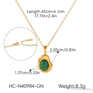 Detailed view of 18K gold bean necklace with green stone pendant and size dimensions