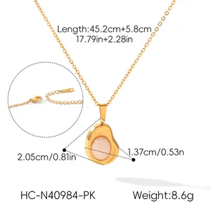 Detailed view of 18K gold-plated bean necklace with pink stone and full dimensions