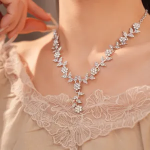 Detailed view of an elegant silver floral vine necklace with shimmering rhinestones