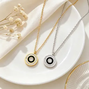 Detail of minimalist titanium steel round necklaces with pavé crystals in gold and silver.