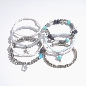 Stylish 8-piece set of beaded bracelets featuring glass beads and a silver star charm