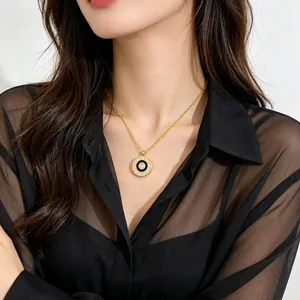 Minimalist gold titanium steel necklace with pavé diamond pendant on Asian model