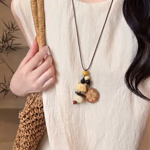 Handcrafted New Chinese style leather rope necklace with wooden beads and a cute cat pendant