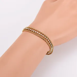 Detail shot of 18K gold plated stainless steel 3-layer rope and zirconia bracelet