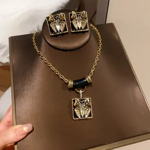 Detail shot of a vintage butterfly jewelry set with black enamel and sparkling rhinestones
