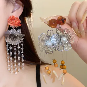 Detail of New Chinese style resin flower tassel earrings with amber beads and pearls