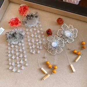 Close-up detail of vintage resin dyed flower tassel earrings with S925 silver needles