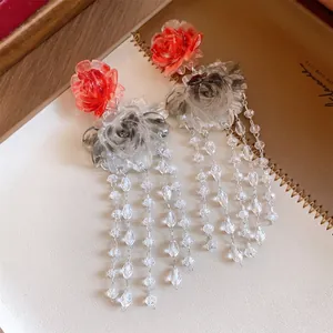Detailed view of vintage resin flower tassel earrings with intricate marbled petals