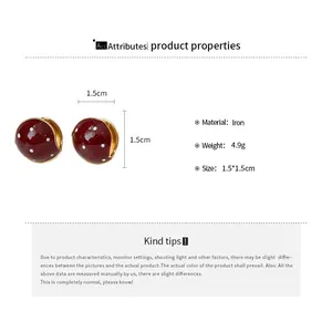 Detail view of red polka dot oil drip earrings with 1.5cm size and iron material specs