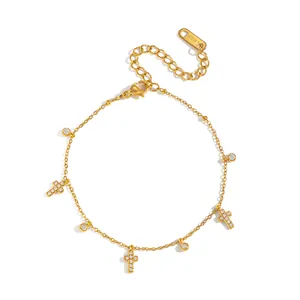 Frans vintage roestvrijstalen kruisarmband met zirkonia hangers en 18K gouden plating.