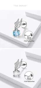 Detailed view of F136 titanium angel wing cartilage studs with internal screw threading.