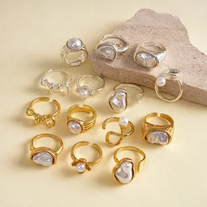 Vintage irregular pearl ring set featuring elegant gold and silver geometric floral designs.