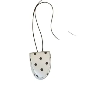 Sweet leather polka dot pendant necklace with minimalist design and long cord cord