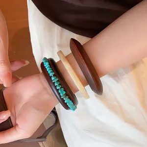 Close-up of Maillard style vintage geometric resin bracelet set with turquoise accents.