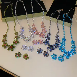 Detailed view of sparkling flower jewelry sets in various vibrant gemstone colors.
