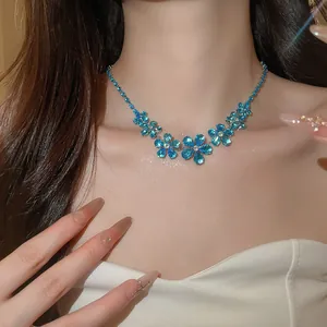 Elegant close-up view of blue zircon flower pendant necklace worn by a female model